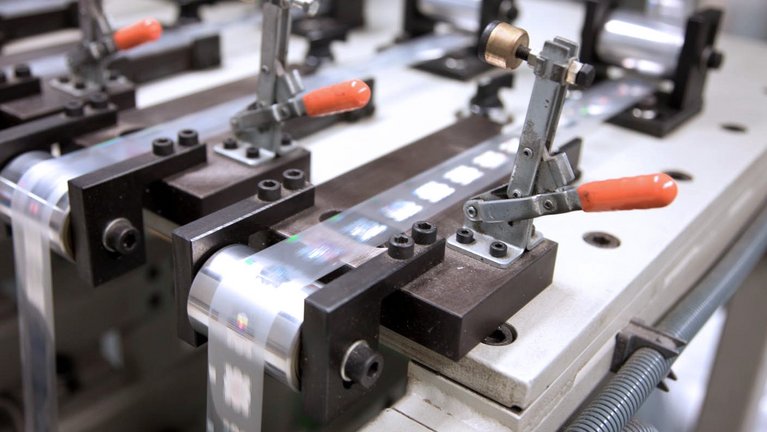 A machine for producing security features for banknotes