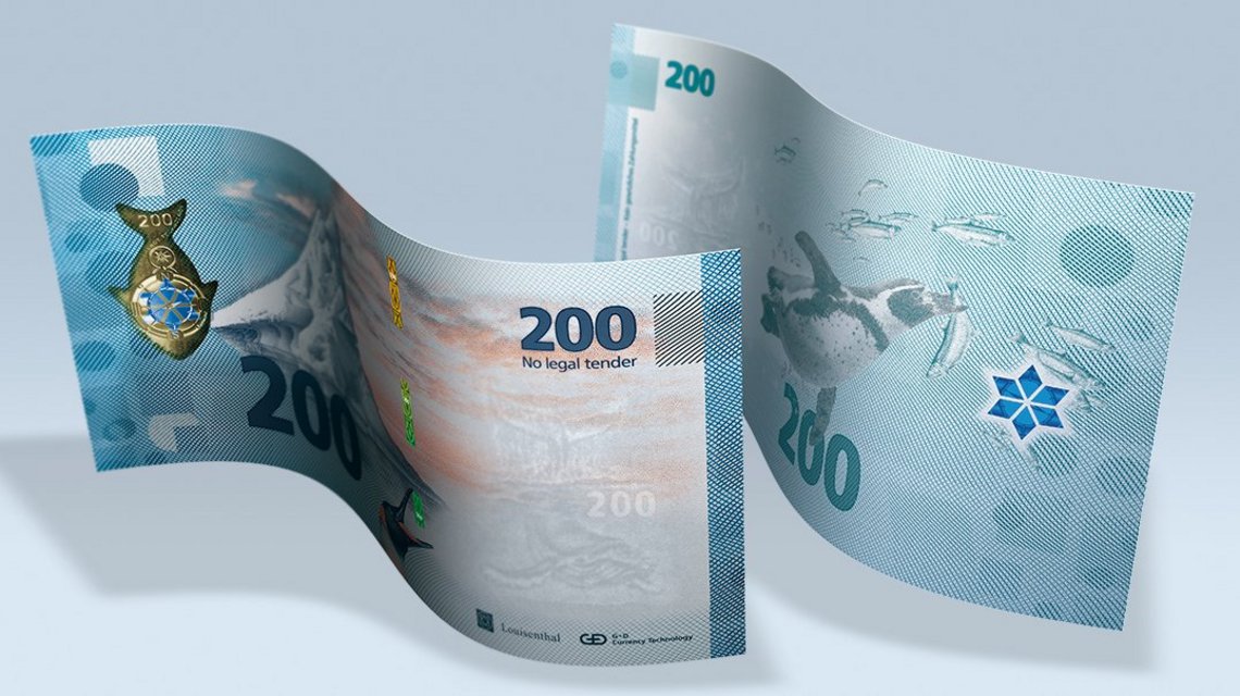 Front and back of a sample note with iceberg motif, a whale as watermark and a ColourChange patch