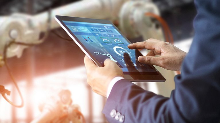 Someone operates an app on a tablet in the IoT environment