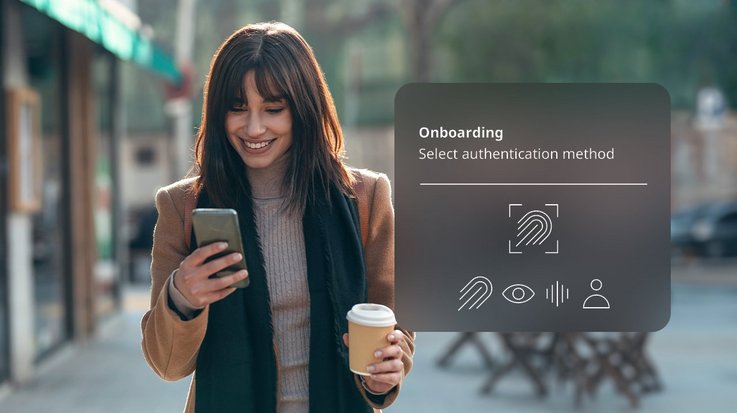 Woman looks at her smartphone and selects an authentication method