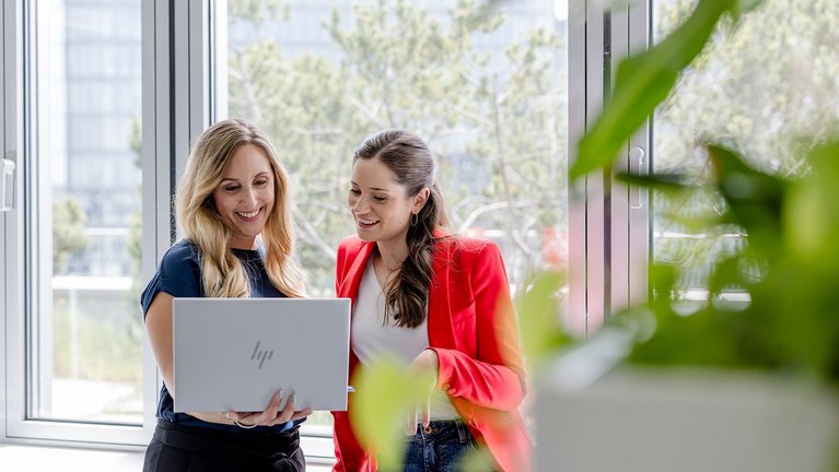 Two women with laptop in an office