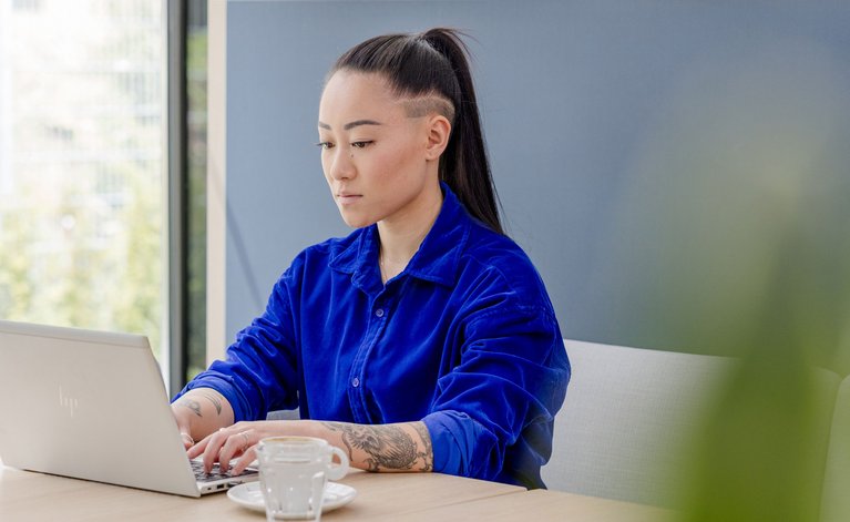 Woman working on laptop in office