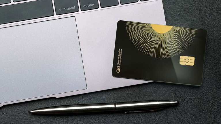 A ceramic payment card on a laptop