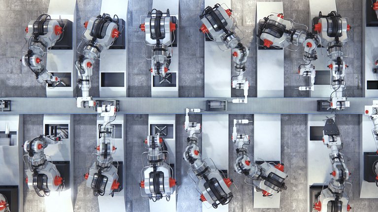 Several robotic arms and working at an assembly line