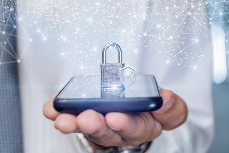 Hand holding a smartphone with a lock icon overlay, symbolizing data security.