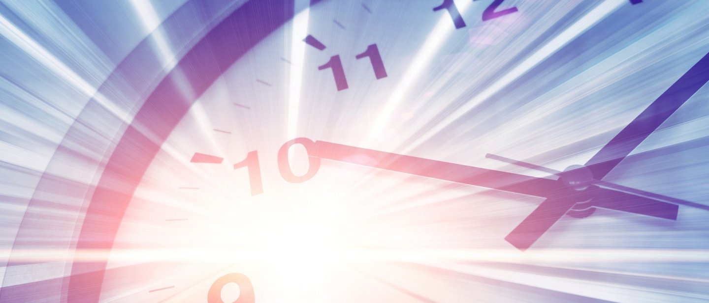 Blurred, dynamic close-up of a clock with light streaks symbolizing motion and time travel.