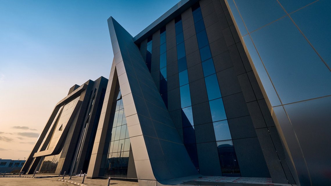 Futuristic building with reflective glass facades from the Central Bank of Egypt