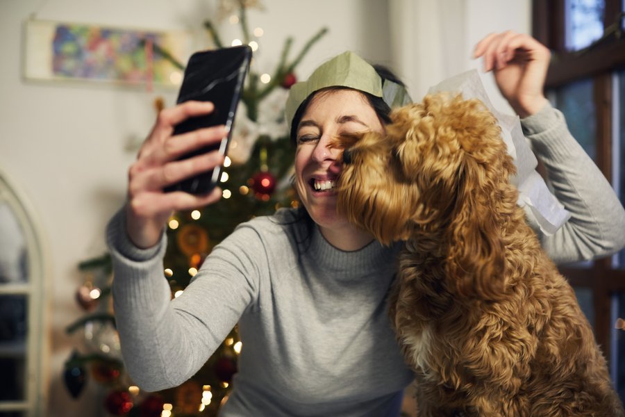 A woman takes a selfie with her dog