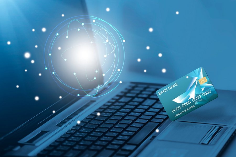Technology concept bank card and a laptop