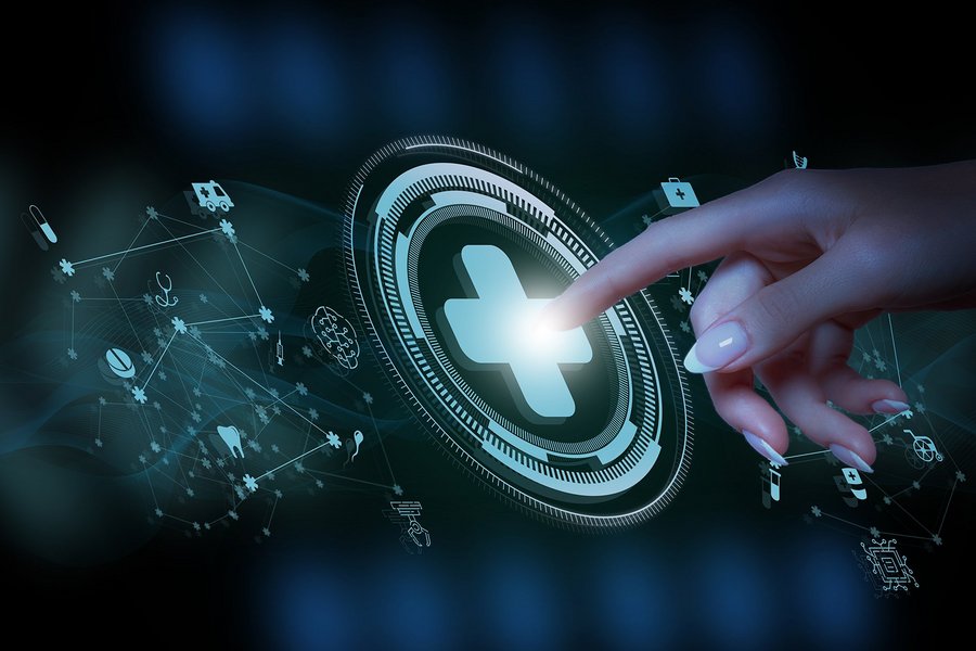 A doctor is working on a computer