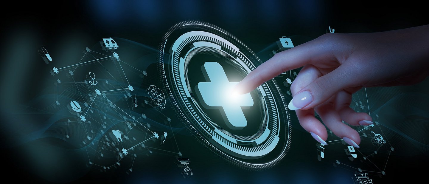 A doctor is working on a computer