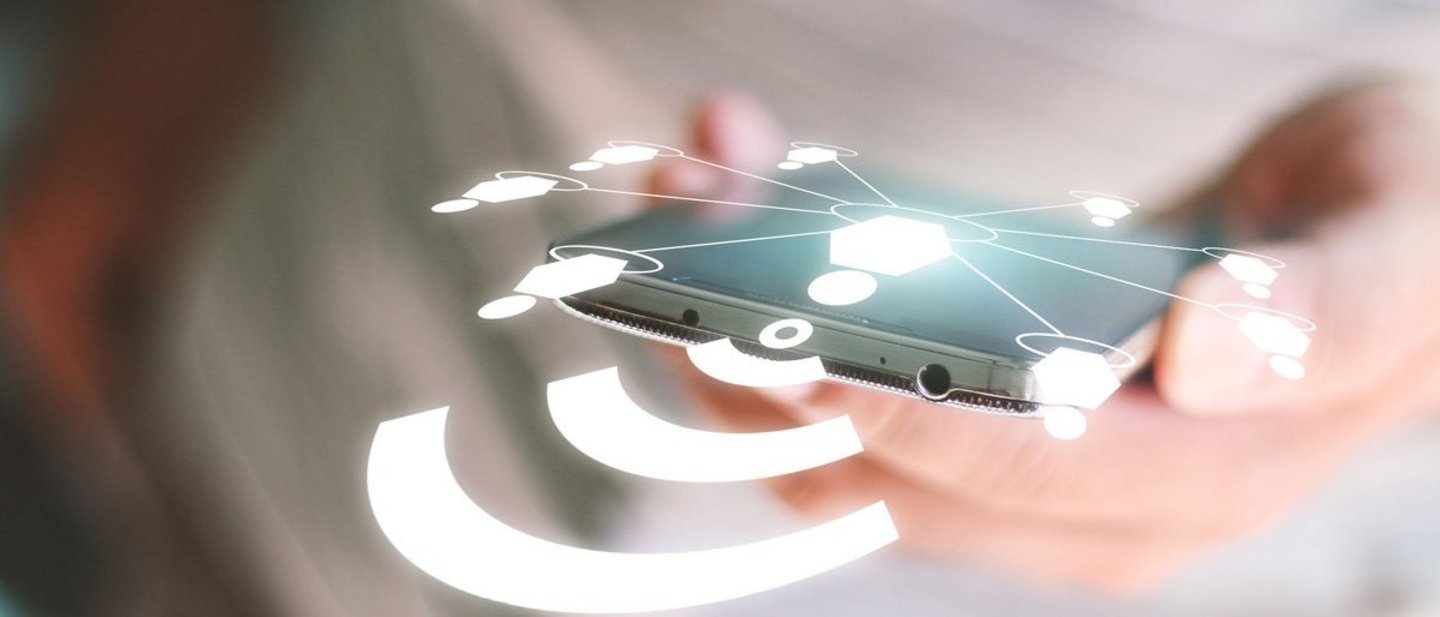 A close up of a woman with a mobile with connected tracks which symbolizes e Government and digital documents