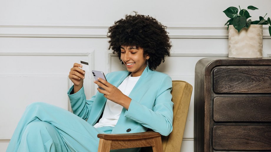 Woman paying via her mobile phone