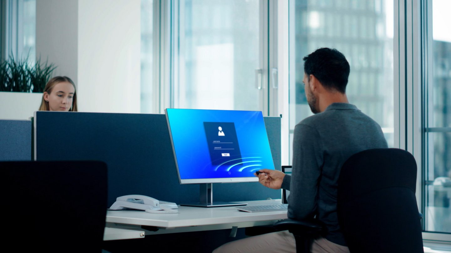 Woman’s hand using key fob to access enterprise building