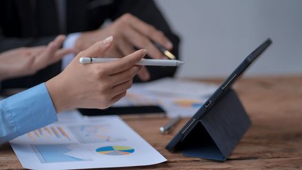 Colleagues engaged in a dynamic brainstorming session, sharing ideas and discussing strategies.