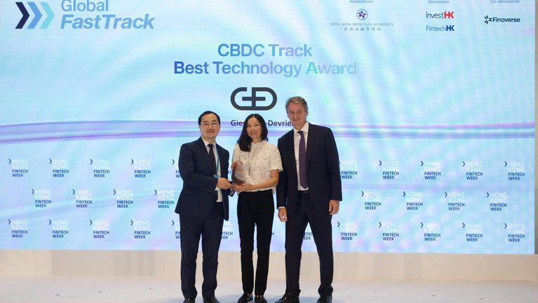 Colin Pou, Executive Director of the HKMA, Polly Bäumler, Business Developer at G+D's CBDC unit and Alexander Seelaender, Head of G+D Hub Asia, Managing Director