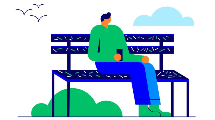 Person sitzt auf einer Parkbank