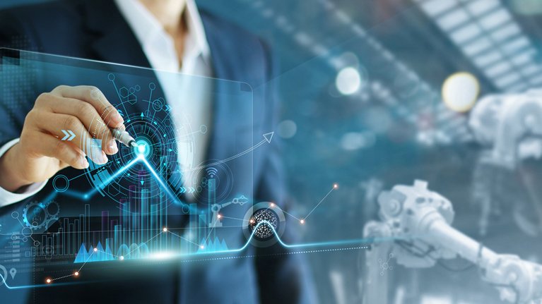 A man uses a fountain pen to operate a digital hologram screen with iot symbols and diagrams