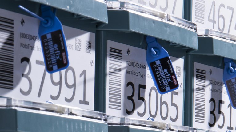 Stacked NotaTrays with accurate markings, barcodes and labels