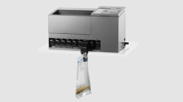 The Coin 300 coin processing system fills sorted coins into a plastic sack