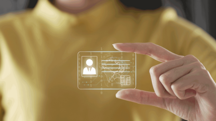 Woman holding a digital frame ID card