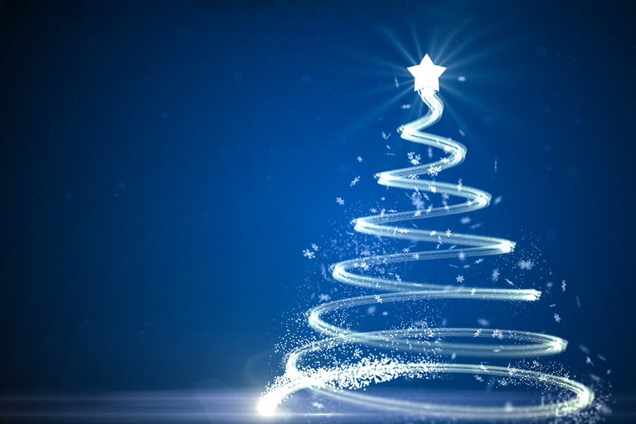 Glowing, spiral-shaped Christmas tree made of light trails with a bright star on top