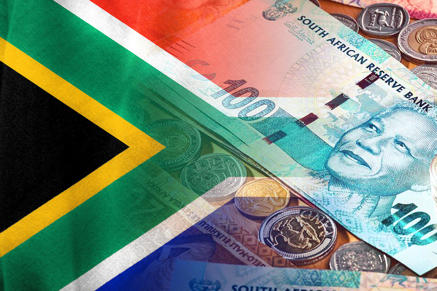 South African cash next to the South African flag